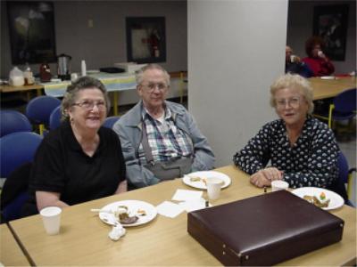 Coin club past president Earl Fritcher along with Dorsille Fritcher and Liselotte Koerner