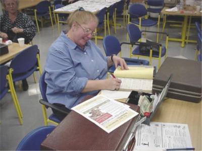 Past coin club treasurer and president Mary Yahalom